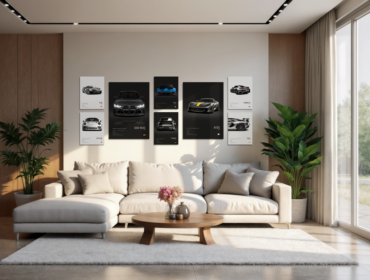 Modern living room with a white sofa, coffee table, and wall art featuring black and white car posters.