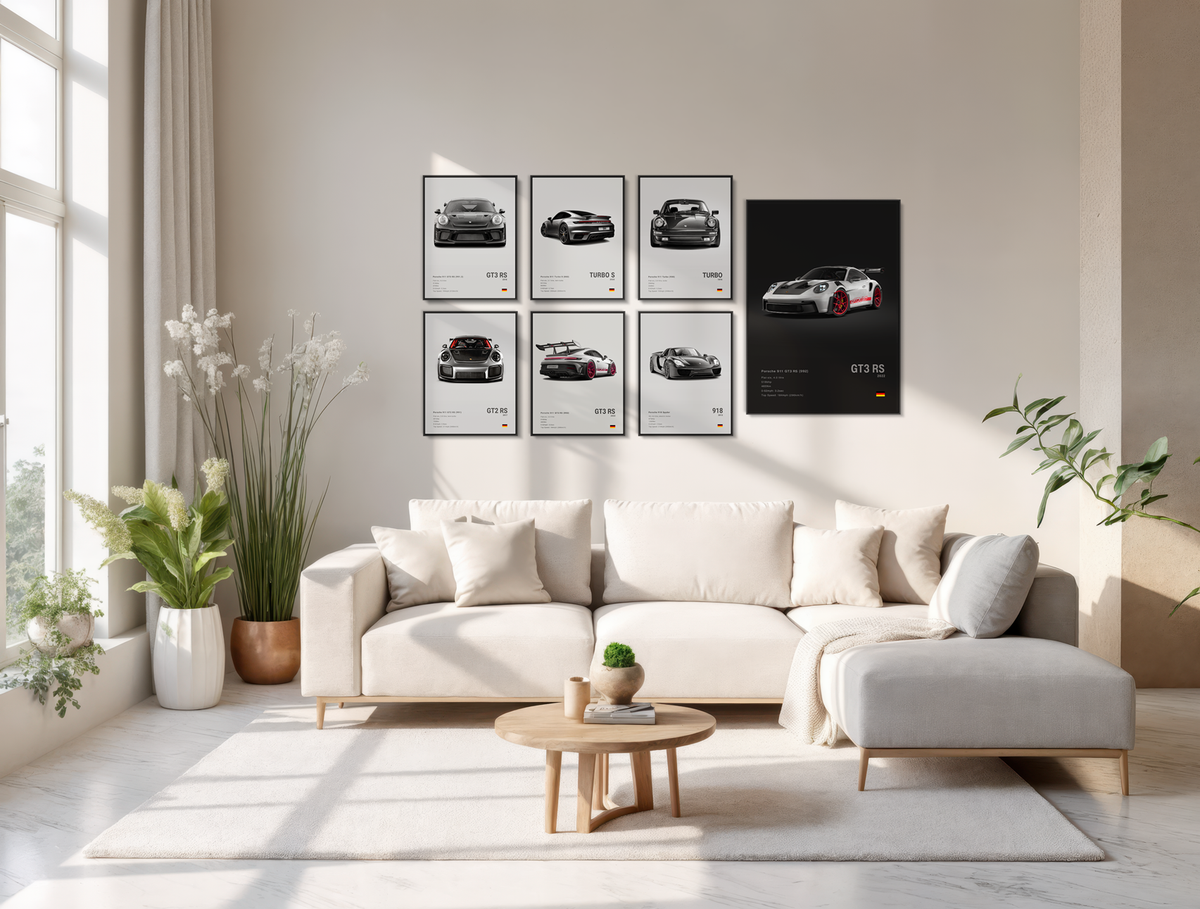Modern living room with a white sofa, coffee table, and decorative Porsche wall art.
