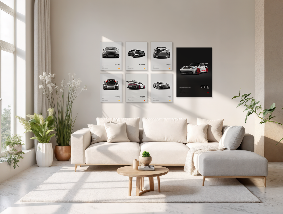 Modern living room with a white sofa, coffee table, and decorative automotive wall art.